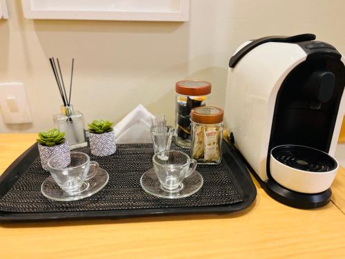 Kemudahan buat kopi dan teh di Quarto de hotel de luxo Congonhas