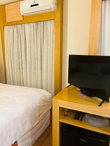 Televisyen dan/atau pusat hiburan di Quarto de hotel de luxo Congonhas