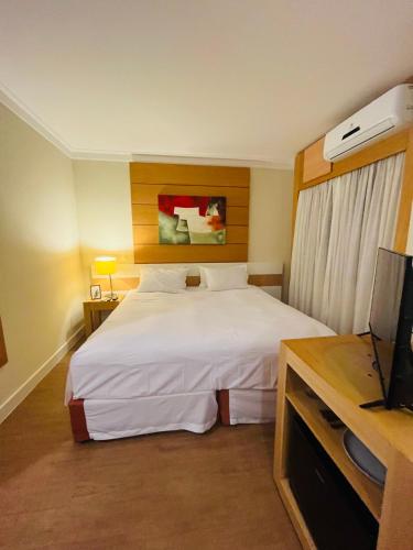Katil atau katil-katil dalam bilik di Quarto de hotel de luxo Congonhas