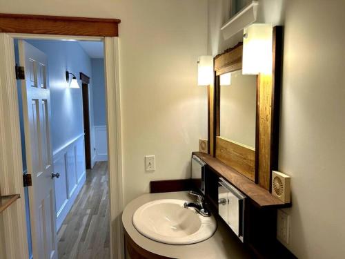 a bathroom with a sink and a mirror at Spacious Medford Gem in Medford