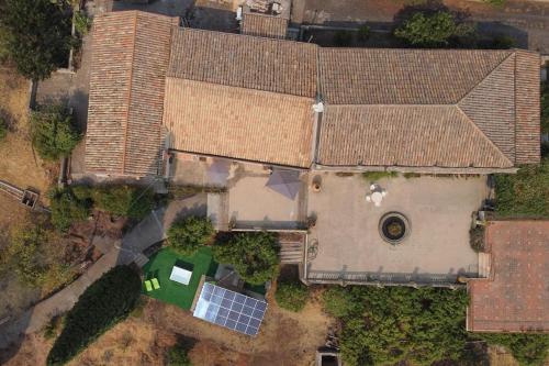 an overhead view of a large house with a roof at Le casette di Marò in Nunziata
