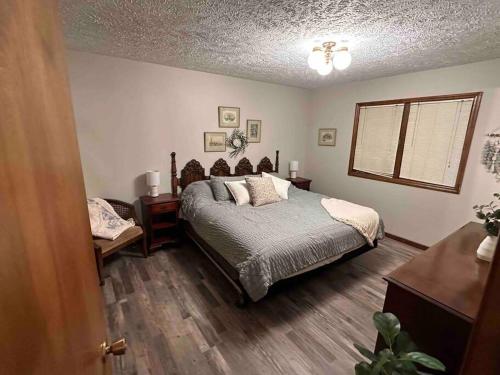 a bedroom with a bed and a window at A great house by Fonner Park in Grand Island