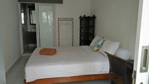 Ліжко або ліжка в номері Pondok Ayu Canggu