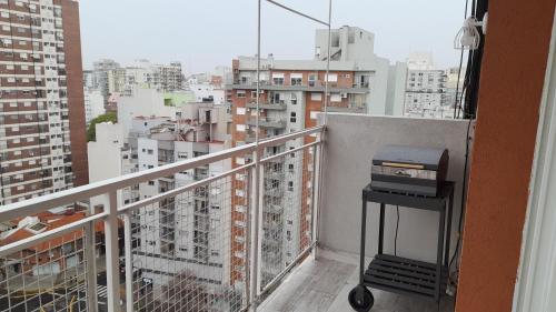 a view of a city from a balcony at TORRE Rivera in Buenos Aires