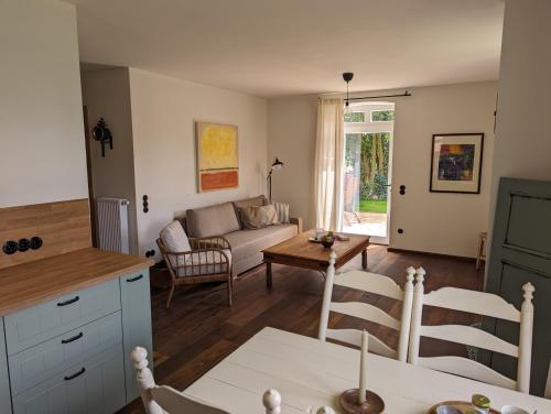 a living room with a couch and a table at Alter Kornspeicher im Münsterland in Greven