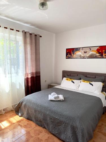 Postel nebo postele na pokoji v ubytování Guest House Ergest
