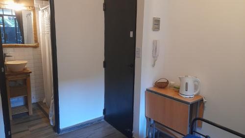 a hallway with a door leading into a room at LA CASITA in Buenos Aires