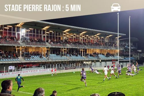 a group of people playing a game of soccer on a field at Le Tranchand☆City Center☆Wifi HD in Bourgoin