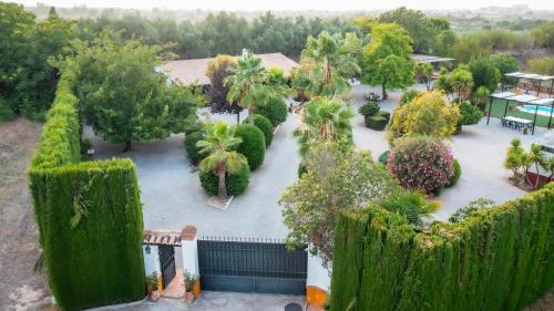 an overhead view of a garden with trees and bushes at LA CUADRA, Finca a los pies de Sierra Nevada, a 10 minutos del centro, Piscina, Jardín, Barbacoa in La Zubia