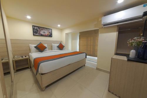 a bedroom with a large bed in a room at Perfect Plus just 5 mins walk to Golden Temple in Amritsar