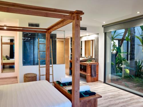 A bed or beds in a room at Can Do It