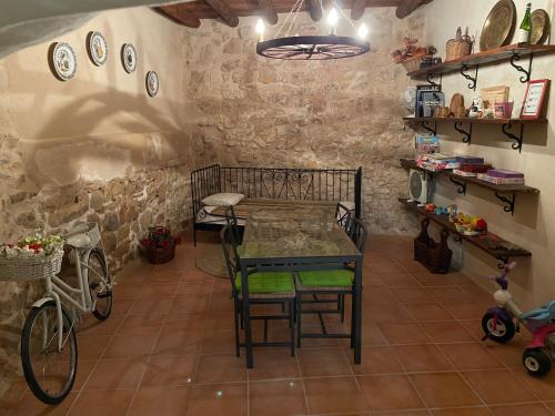 a kitchen with a table and chairs in a room at Casa Lidia - Antigua Posada Real in Valderrobres