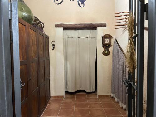 a door with a curtain in a hallway with a stairway at Casa Lidia - Antigua Posada Real in Valderrobres