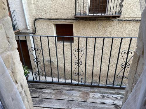 a balcony with a gate on a building at Casa Lidia - Antigua Posada Real in Valderrobres