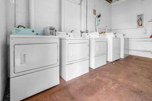 a group of white washing machines in a room at Port of the Islands M264 in Naples