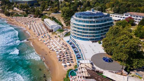 an aerial view of a beach with umbrellas and a building at SPA Hotel Sirius Beach - FREE SPA access in St. St. Constantine and Helena