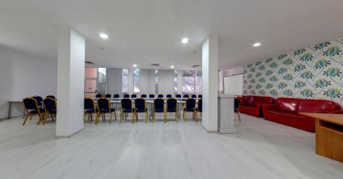 a conference room with a long table and chairs at SPA Hotel Sirius Beach - FREE SPA access in St. St. Constantine and Helena