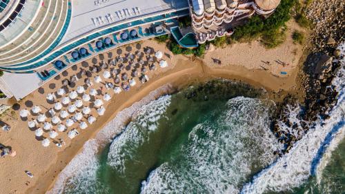 an aerial view of a beach with umbrellas and chairs at SPA Hotel Sirius Beach - FREE SPA access in St. St. Constantine and Helena