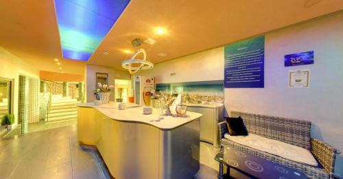 a kitchen with a table and chairs in a room at SPA Hotel Sirius Beach - FREE SPA access in St. St. Constantine and Helena