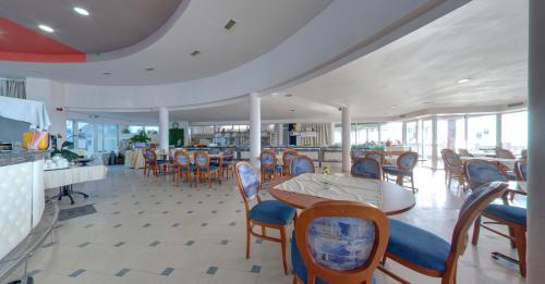 a dining room with a table and chairs at SPA Hotel Sirius Beach - FREE SPA access in St. St. Constantine and Helena
