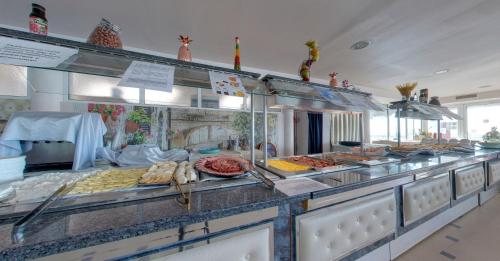 a buffet line with many different types of food at SPA Hotel Sirius Beach - FREE SPA access in St. St. Constantine and Helena