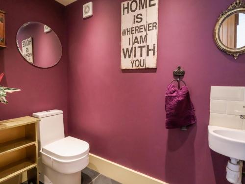 a bathroom with a toilet and a sink at Garreg Wen in Holywell