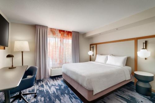 a hotel room with a bed and a desk at Fairfield Inn & Suites by Marriott Yakima in Yakima