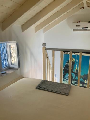 Posteľ alebo postele v izbe v ubytovaní Little Symi House