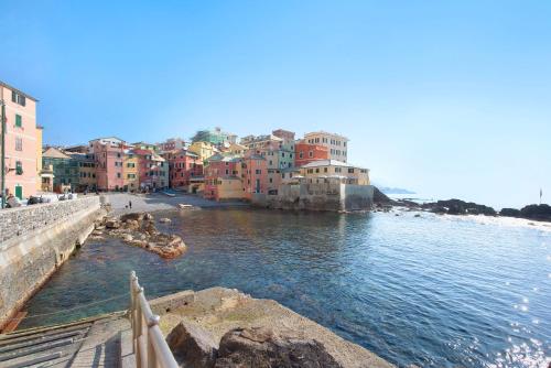 a group of buildings on the side of a body of water at Il ciliegio di Miki in Genova