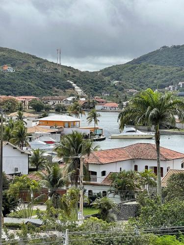 a town with palm trees and a body of water at hihome - Royale in Cabo Frio