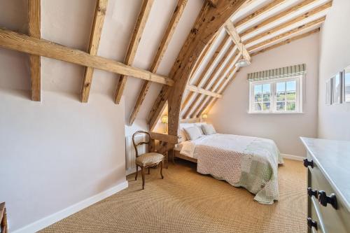 a bedroom with a bed and a window at The Old Court House in Cerne Abbas