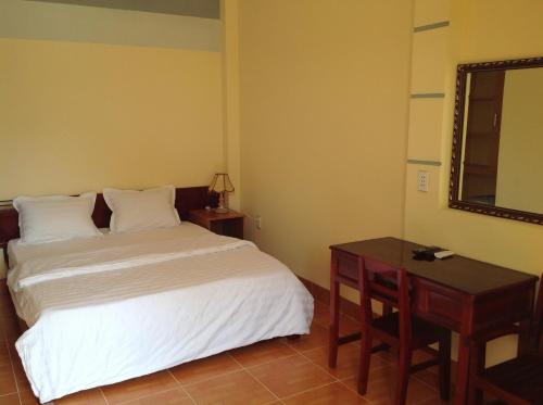 Postel nebo postele na pokoji v ubytování Aurora Mekong Hotel