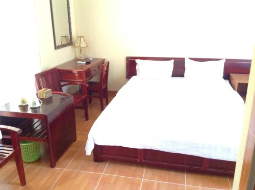Postel nebo postele na pokoji v ubytování Aurora Mekong Hotel