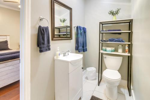 a bathroom with a toilet and a sink and a mirror at Serene Kings Mountain Home Near 2 Kings Casino! in Kings Mountain