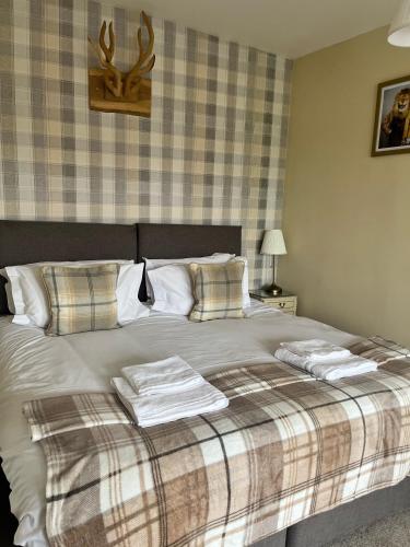 Ένα ή περισσότερα κρεβάτια σε δωμάτιο στο The Lion Hotel