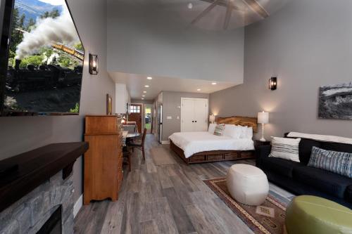 a bedroom with a bed and a living room at Tamarron HighPoint - 571 in Durango