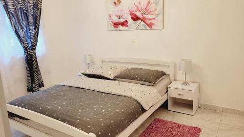 Ένα ή περισσότερα κρεβάτια σε δωμάτιο στο Sea view apartments in Villa Esperia