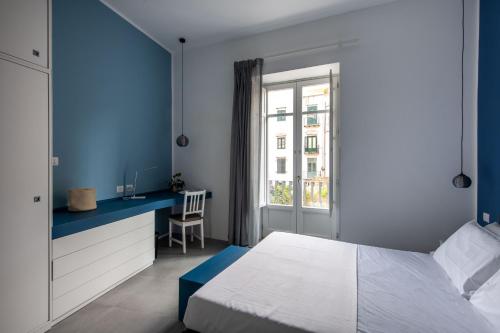 Ένα ή περισσότερα κρεβάτια σε δωμάτιο στο Casa Azul alla Cala by Wonderful Italy