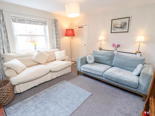 a living room with two couches and a couch at Tivoli in Retford