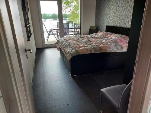 Postel nebo postele na pokoji v ubytování Ferienhaus Sundhäuser See