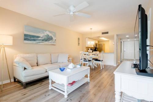 a living room with a couch and a table at Park Shore Resort Beautiful Top Floor 2Bed 2Bath in Naples