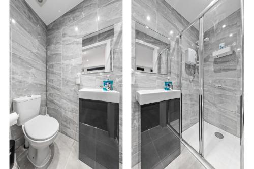 uma casa de banho com um WC, 2 lavatórios e um chuveiro em Serviced Ensuite Room Finsbury Park London N19 em Londres