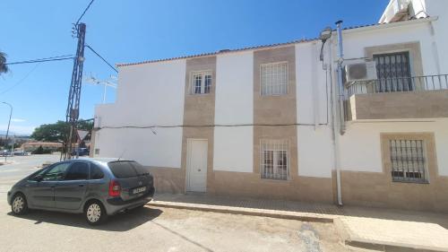 a car parked in front of a building at Casa Nina in Linares