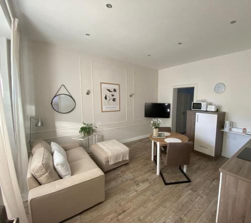 a living room with a couch and a table at Apartment 229 in Dortmund