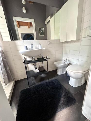 a bathroom with a sink and a toilet at La Corte di Saronno in Saronno