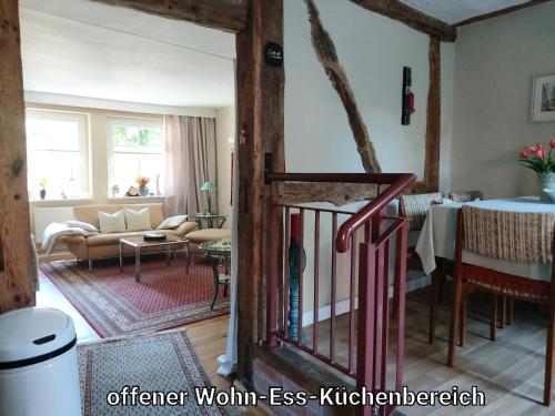 a living room with a couch and a table at Alte Schule Mankmuß in Karstädt