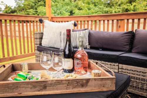 a wooden crate with wine bottles and glasses on a patio at Sleeps 10! Minutes to Parris Island & Downtown in Beaufort
