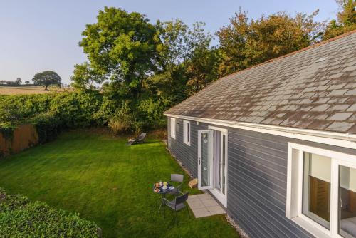 an aerial view of a house with a yard at Trewhiddle 40 - A Luxury Cottage by Together Travel in St Austell