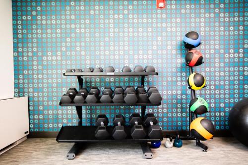 a rack of boxing equipment in a room at La Quinta by Wyndham Dallas I-35 Walnut Hill Ln in Dallas