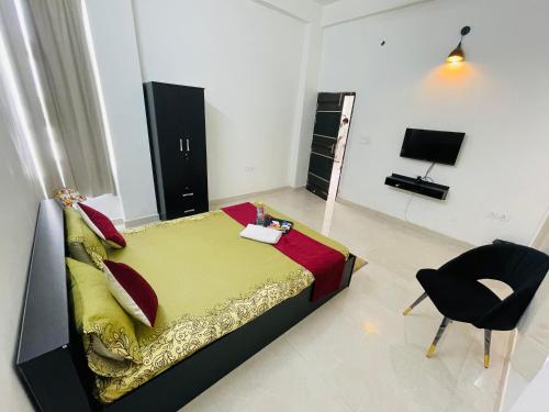 TV o dispositivi per l'intrattenimento presso Atulyam Stays Sushant Golf City
